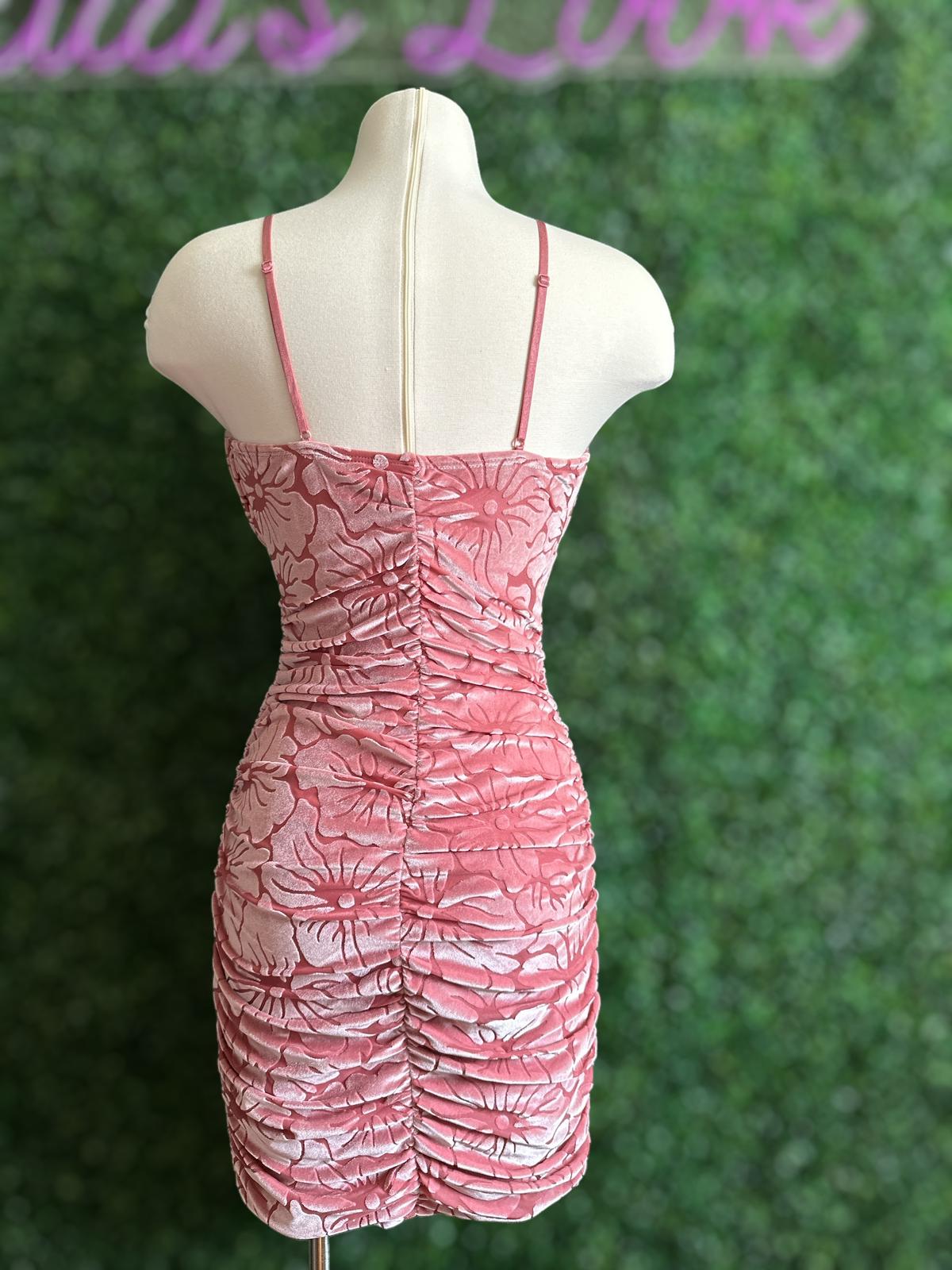 Short dress with stretch material and adjustable spaghetti straps.